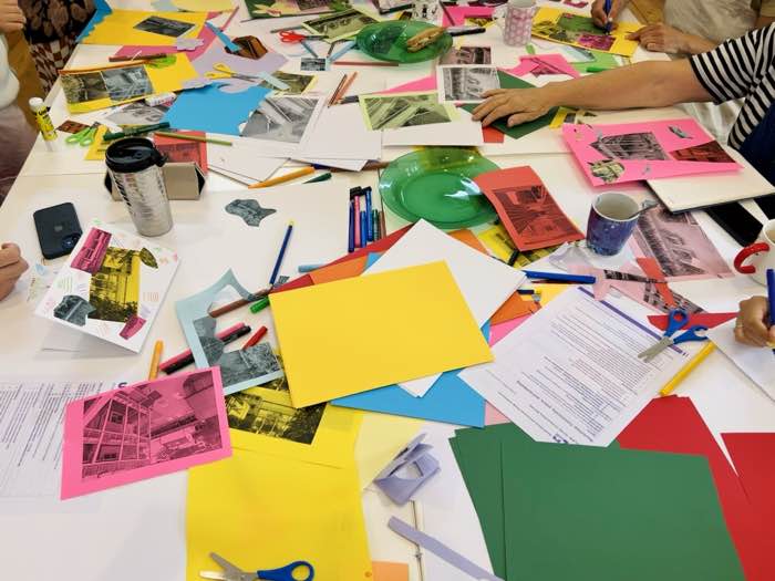 Workshop table with collage materials in progress